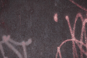 Fragment of a rusty grunge surface. Dark brown background color. Scuffs and peeling of old paint....