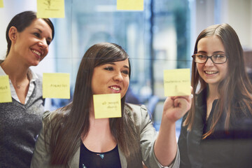 Office, collaboration and business people with sticky note for planning, solution and discussion....