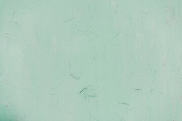 Fragment of a rusty grunge surface. Orange-green background color. Scuffs and peeling of old paint....