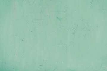 Fragment of a rusty grunge surface. Orange-green background color. Scuffs and peeling of old paint....