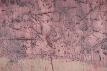 Fragment of a rusty grunge surface. Orange-green background color. Scuffs and peeling of old paint....