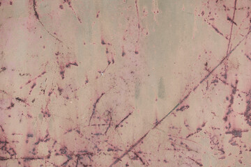 Fragment of a rusty grunge surface. Orange-green background color. Scuffs and peeling of old paint....