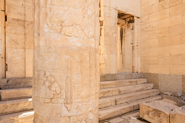 A tall column with a lot of detail on it, the Acropolis of Athens