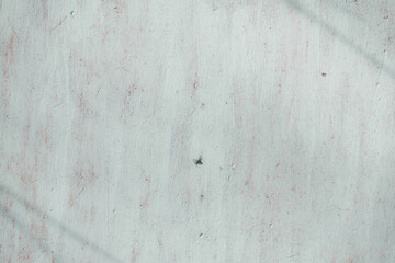 Fragment of a rusty grunge surface. Orange-blue background color. Scuffs and peeling of old paint....