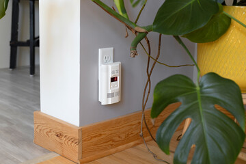 Carbon monoxide detector plugged into wall outlet