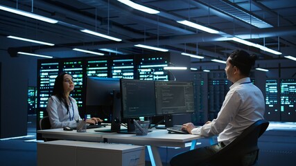 Developer and coworker overseeing data center, making improvements and updates to ensure system can...