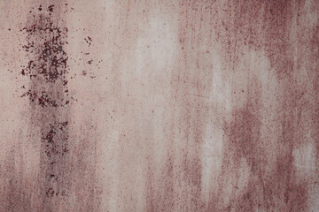 Fragment of a rusty grunge surface. Orange-brown background color. Scuffs and peeling of old paint....
