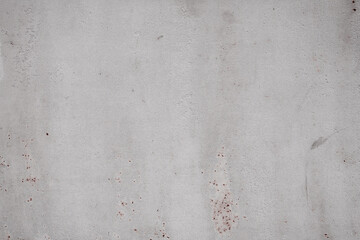 Fragment of a rusty grunge surface. Orange-brown background color. Scuffs and peeling of old paint....