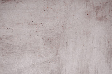 Fragment of a rusty grunge surface. Orange-brown background color. Scuffs and peeling of old paint....