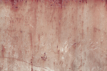 Fragment of a rusty grunge surface. Orange-brown background color. Scuffs and peeling of old paint....