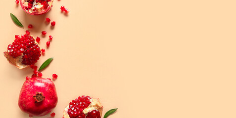 Tasty ripe pomegranate pieces on beige background