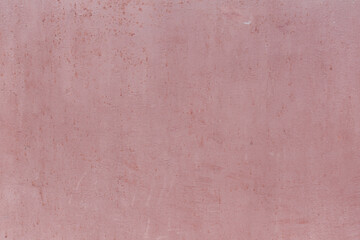 Fragment of a rusty grunge surface. Orange-brown background color. Scuffs and peeling of old paint....