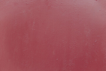Fragment of a rusty grunge surface. Orange-brown background color. Scuffs and peeling of old paint....