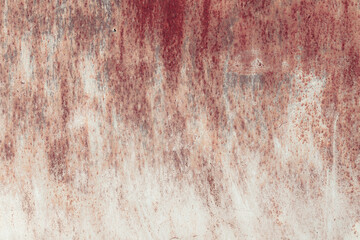 Fragment of a rusty grunge surface. Orange-brown background color. Scuffs and peeling of old paint....
