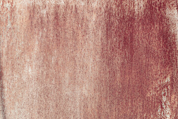 Fragment of a rusty grunge surface. Orange-brown background color. Scuffs and peeling of old paint....