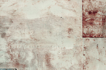 Fragment of a rusty grunge surface. Orange-brown background color. Scuffs and peeling of old paint....