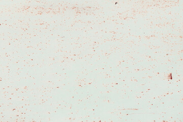 Fragment of a rusty grunge surface. Orange-brown background color. Scuffs and peeling of old paint. Scratches and traces of a welding seam.