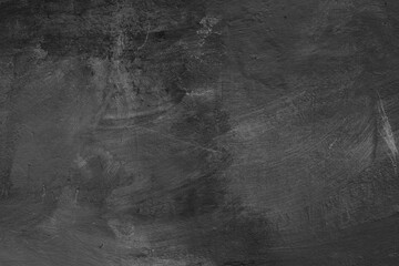 Monochrome texture of a concrete wall with natural relief and damage in the form of chips and...