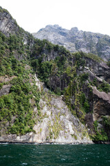 Photograph of some of the tall cliffs that surround Milford Sound.