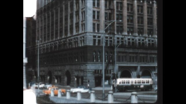 Chicago Traffic 1957 - Buses and cars travel through the intersection of Michigan Avenue and Congress Parkway, now Ida B. Wells Drive, in Chicago, Illinois, 1957.