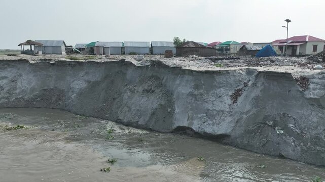 River Erosion in Bangladesh: Homes are disappearing on the river banks. 4k video smooth video shoot