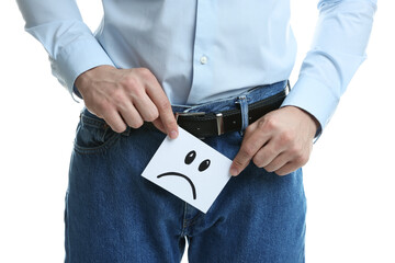 STD (sexually transmitted diseases). Man holding sticky note with drawn sad face on white...