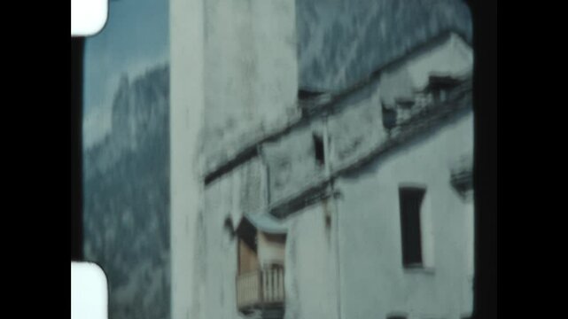 Rural Belltower in Italy 1975 - Viewing a rural bell and clock tower in a small town in the Italian Apls, in 1957. 