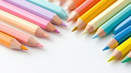 Fototapeta premium Colorful pencils arranged in vibrant display, showcasing various pastel shades and hues. Perfect for art projects and creative activities