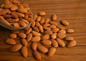 almonds, nuts in a bowl, table background, healthy snack