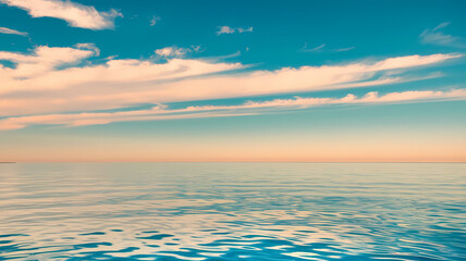 Naklejka premium Serene ocean view with calm waters reflecting a blue sky and soft clouds, creating a peaceful coastal landscape. Perfect for relaxation and nature enthusiasts.