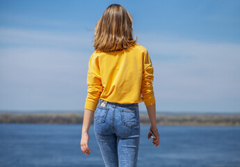 Young beautiful girl in blue jeans