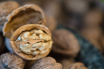 Half open walnut against a blurry background