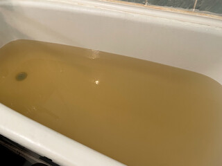 Rusty water in the bathroom. Dirty water comes from the tap. Bad plumbing.
