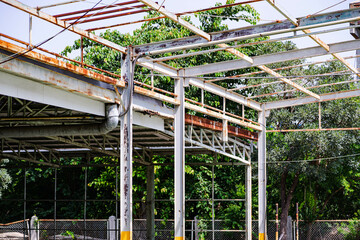 Steel structure in an old factory full of rust