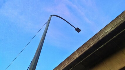 Electric pole against blue sky