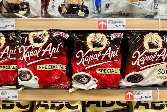 Jakarta, Indonesia - November 3rd, 2024 - Kapal Api instant coffee product packaging display isolated on horizontal ratio indoor supermarket shelf background.