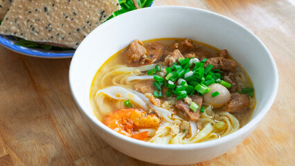 Vietnamese noodle Mi Quang. Mi Quang, Vietnamese rice noodles with meat, chicken stock, shrimp, egg, Vietnamese food.