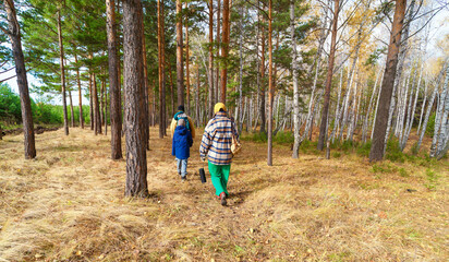 Fototapeta premium family walks with sound speaker in forest