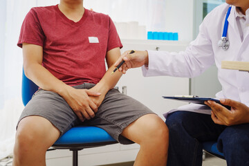 A man consults a doctor in a hospital for a male urinary tract infection. The doctor advises on...