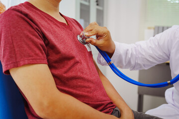 A man consults a doctor in a hospital for a male urinary tract infection. The doctor advises on...