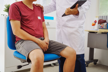 A man consults a doctor in a hospital for a male urinary tract infection. The doctor advises on...