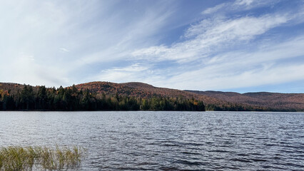 Autumn Landscape with a lake and mountains in the background. Quebec, Canada.