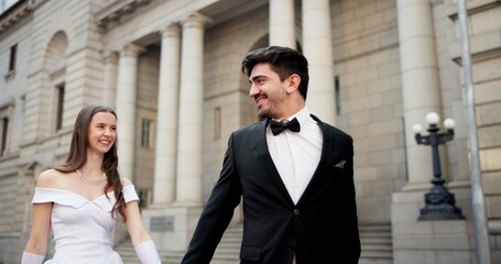 City, building and couple at wedding with smile, walking and bride with groom in street together. Urban romance, man and woman with court marriage, commitment and happy outdoor celebration of love