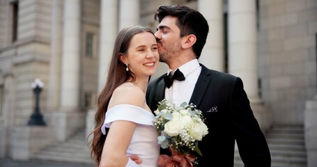 Wedding, happy and couple in city kiss at marriage ceremony, celebration and love event. Romance,...