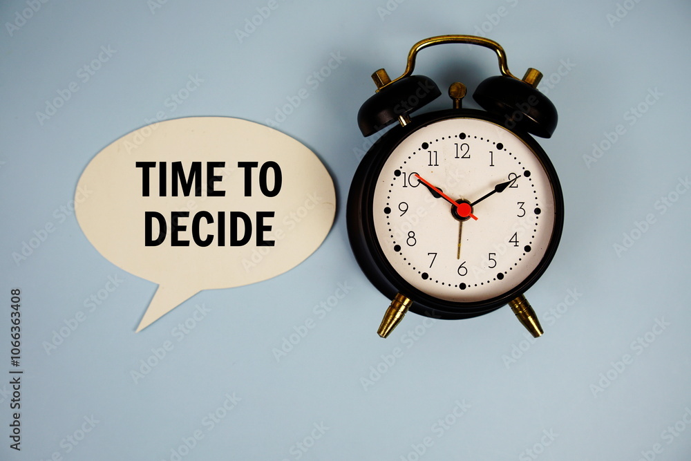 Poster time to dicide text on speech bubble with alarm clock top view on blue background