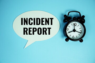 Incident Report text on speech bubble with alarm clock top view on blue background