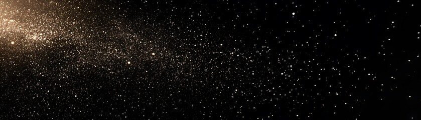 Obraz premium A Scattering of Golden Glitter on a Black Background
