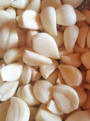 Peeled garlics background