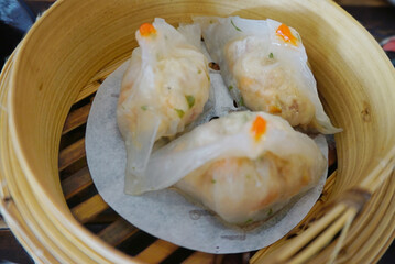 Close up shot of shrimp hargao in bamboo basket, High angle view