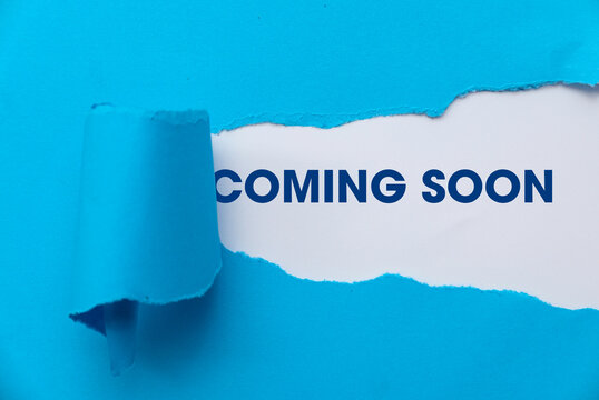 Blue Torn Paper Revealing the Word 'Coming Soon'.